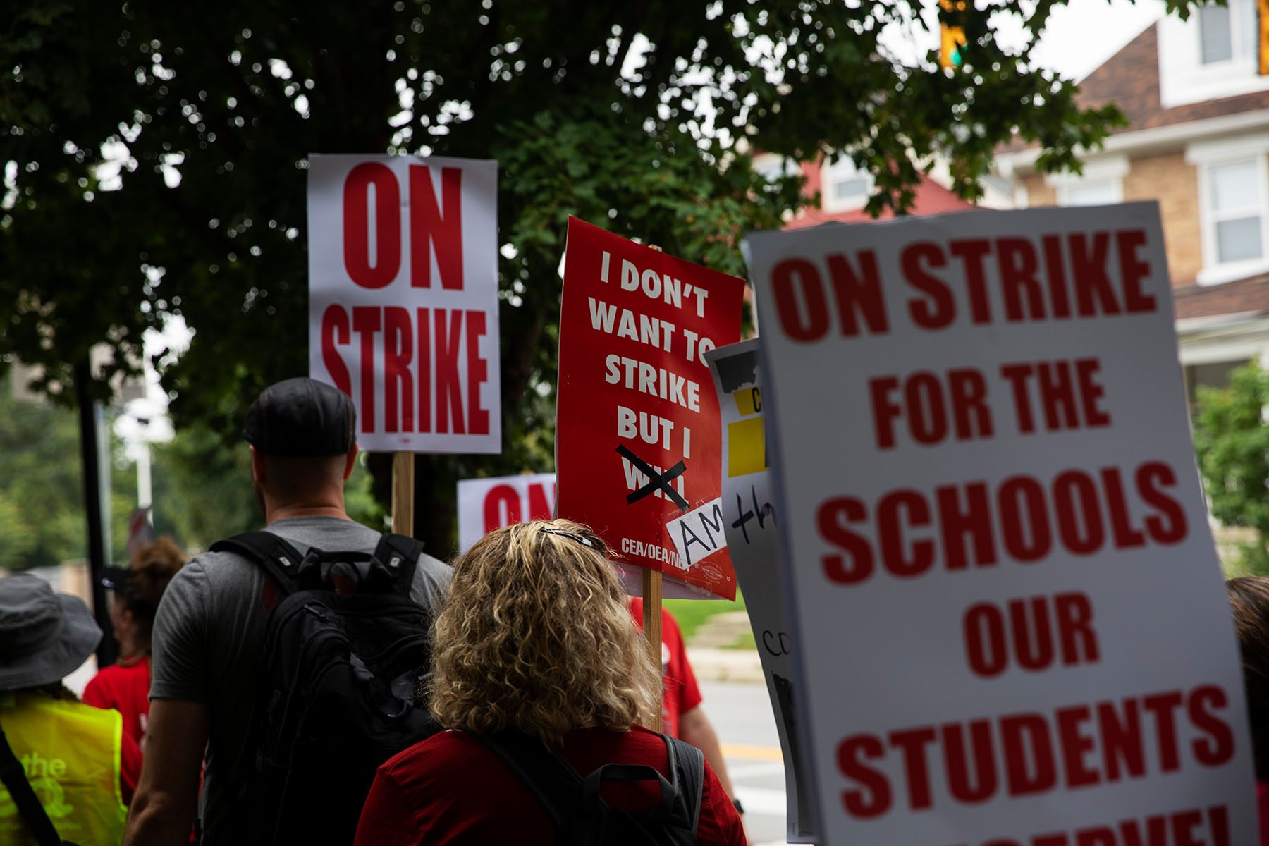 Columbus City School teachers strike outside of Livingston Elementary School. They carry signs that read "On Strike," "I don't want to strike but i will." and "on strike for the schools our students deserve."