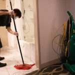 A housekeeper cleans a bathroom at a San Fransisco hotel.