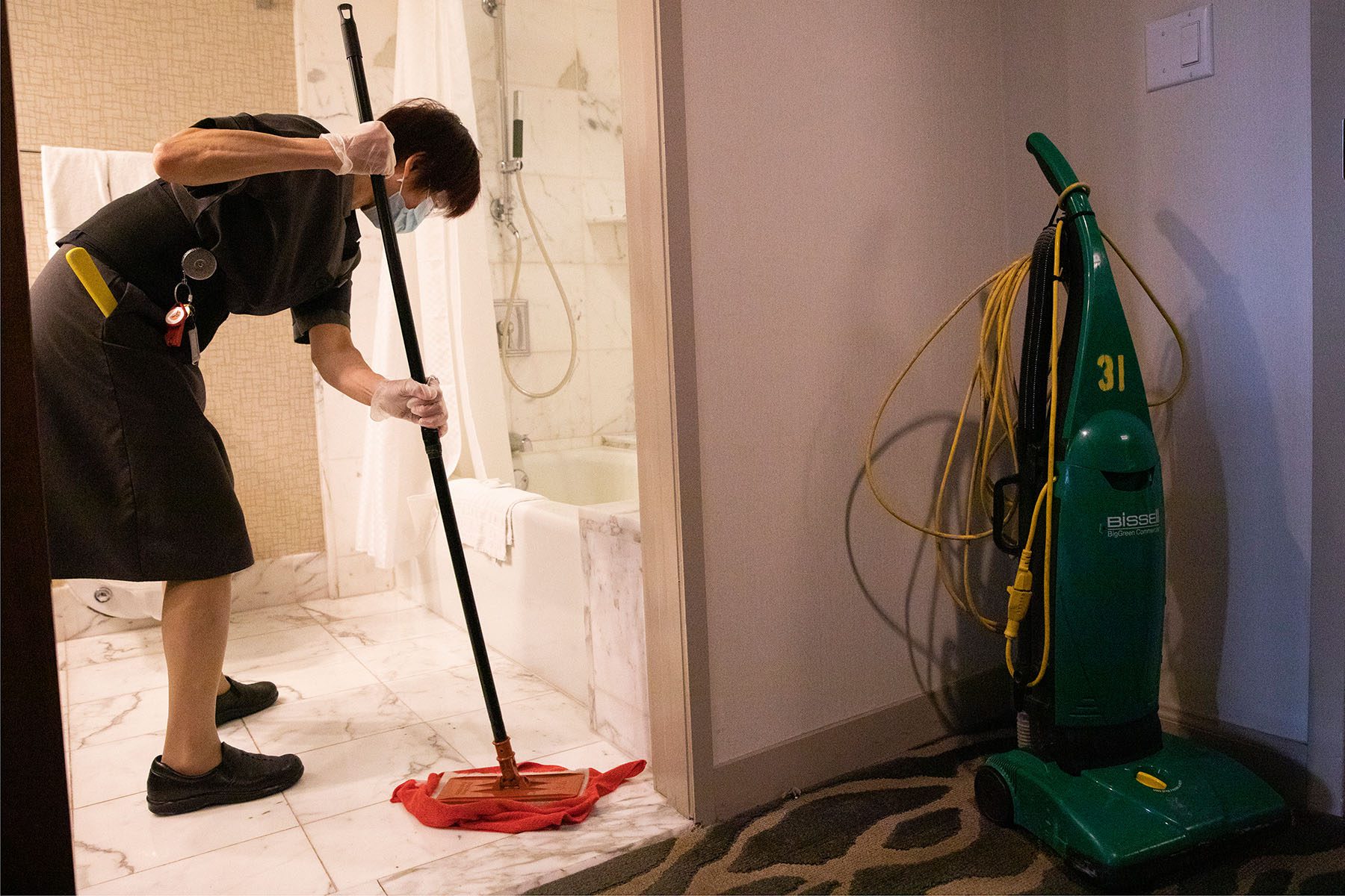 A housekeeper cleans a bathroom at a San Fransisco hotel.