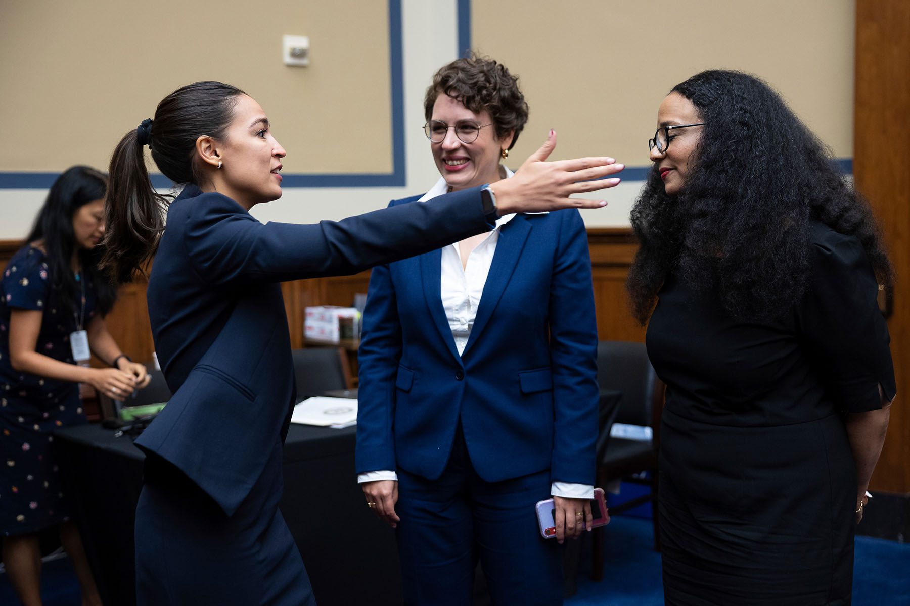 Rep. Alexandria Ocasio-Cortez greets Raya Salter after the hearing.