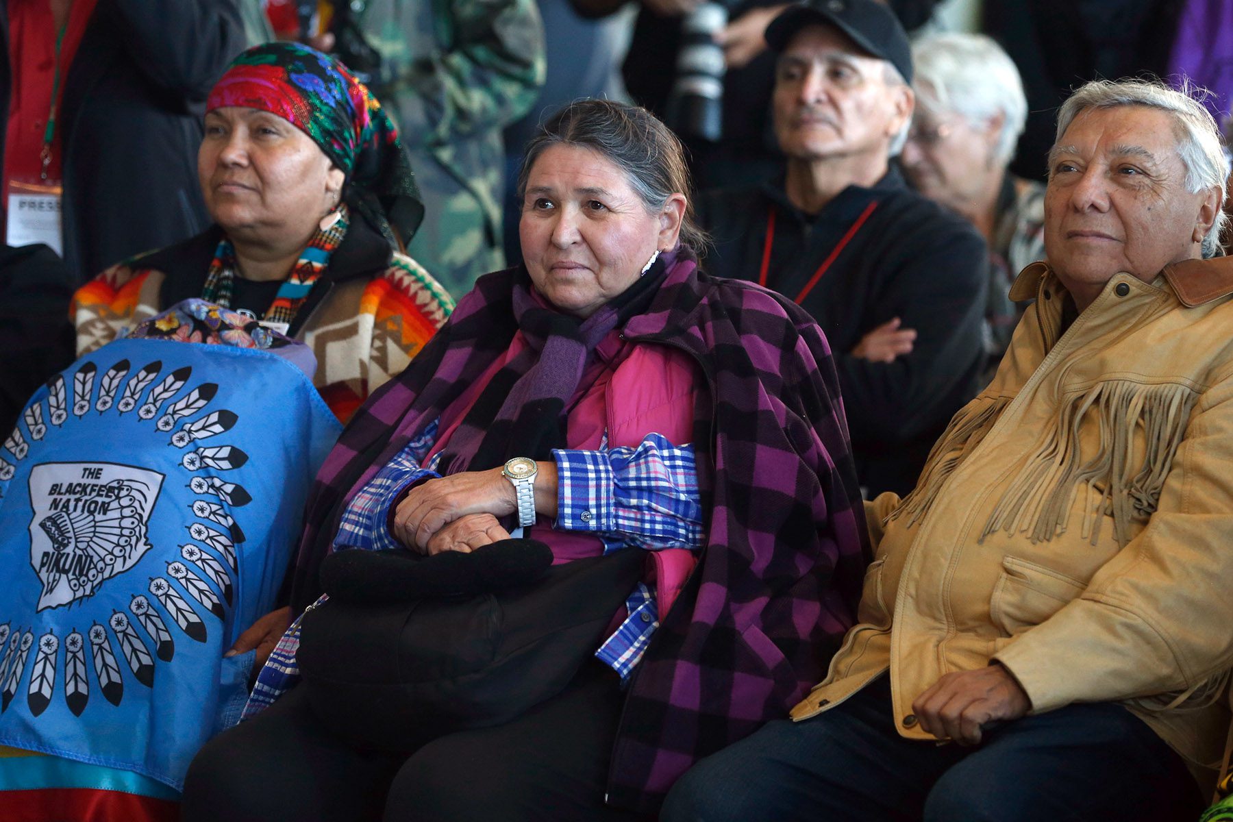 Sacheen Littlefeather sits while attending a ceremony.