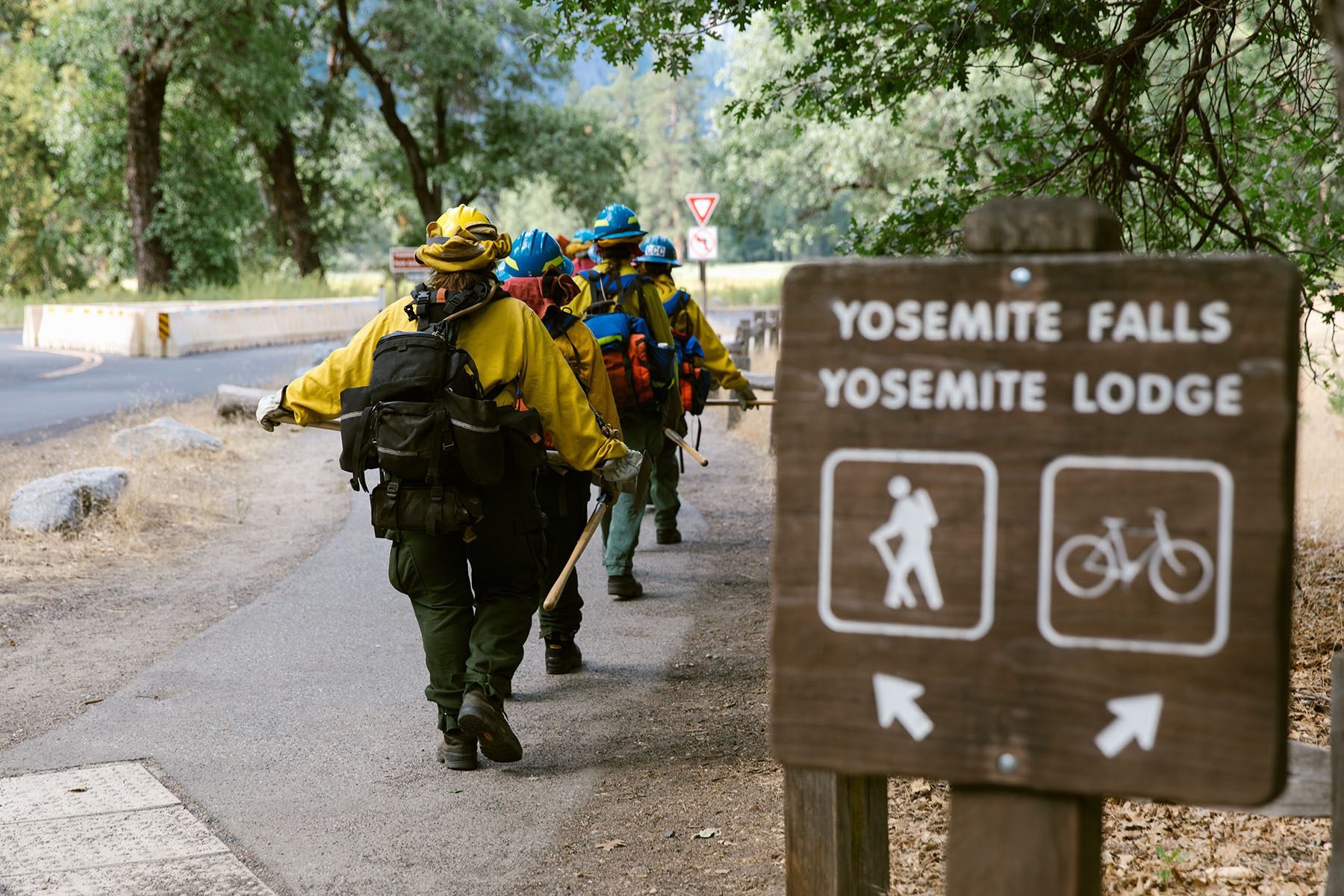 Yosemite’s all-women wildland fire crew walk in unison to their burn pile project in Yosemite National Park.
