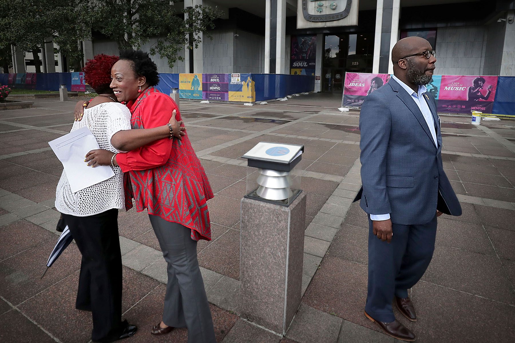 Activist Pamela Moses hugs a woman before a May Day Rally outside City Hall in Memphis.