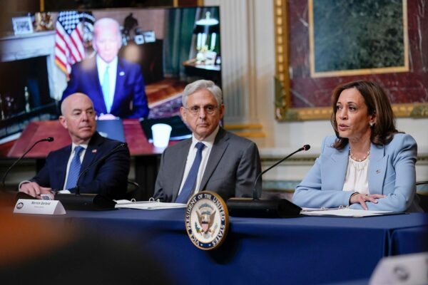Vice President Kamala Harris speaks during the first meeting of the interagency Task Force on Reproductive Healthcare Access. President Biden can be seen tuning in remotely on a screen.