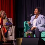 Stacey Abrams speaks to journalist Errin Haines on stage during a 19th event in Atlanta.
