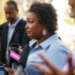 Stacey Abrams speaks to the media after an event at Georgia State University