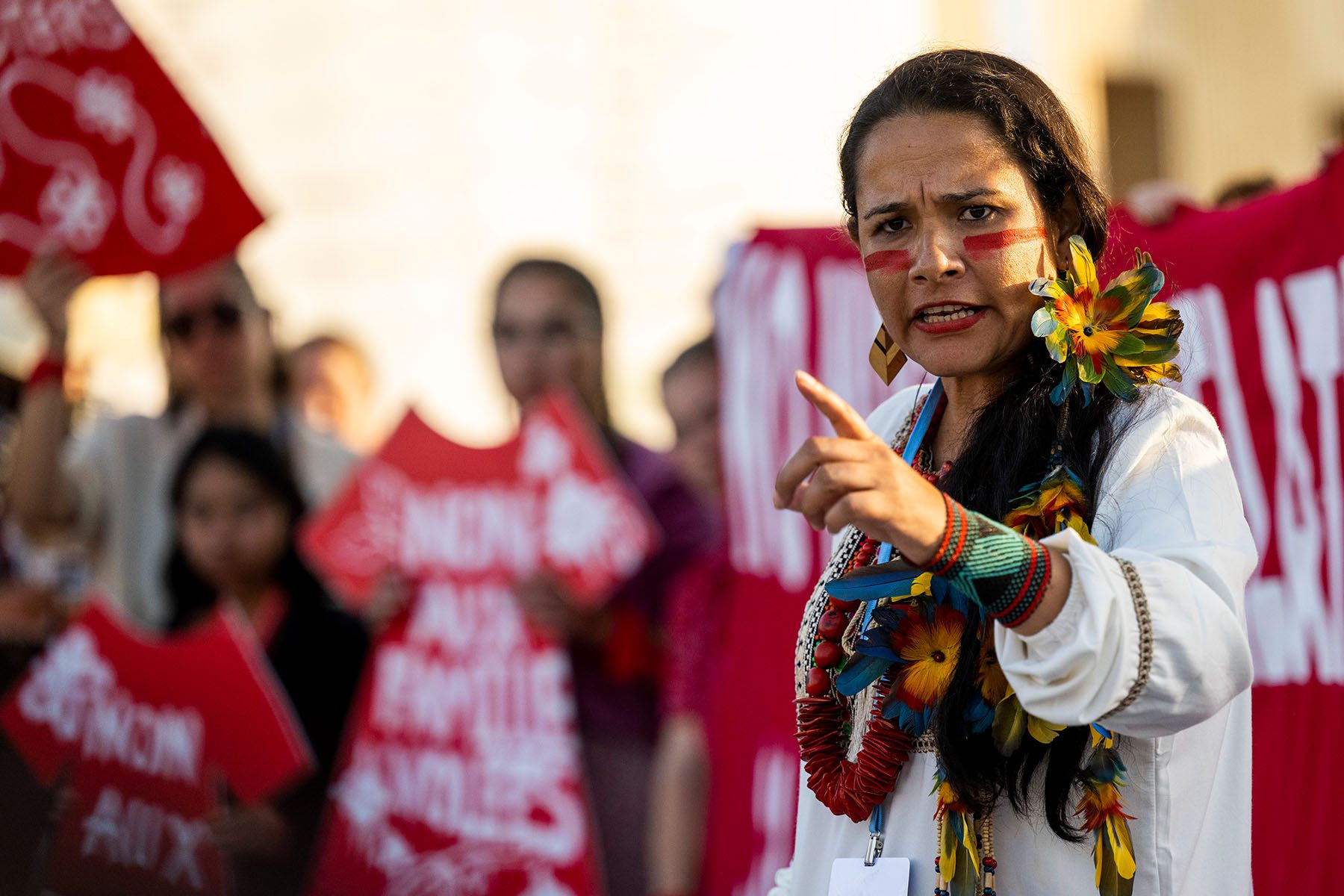 An Indigenous woman speaks during a demonstration calling attention to stolen land.