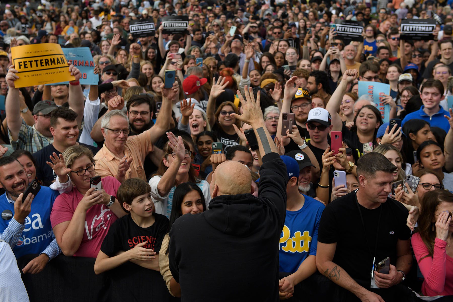 John Fetterman greets a huge crowd of supporters after delivering a speech.