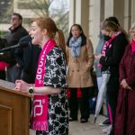 Mallory McMorrow speaks at podium during an abortion rights rally on the steps on the Michigan State Capitol