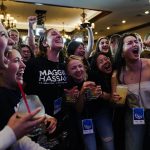 Supporters jump for joy and cheer during an election night watch party for Sen. Maggie Hassan.