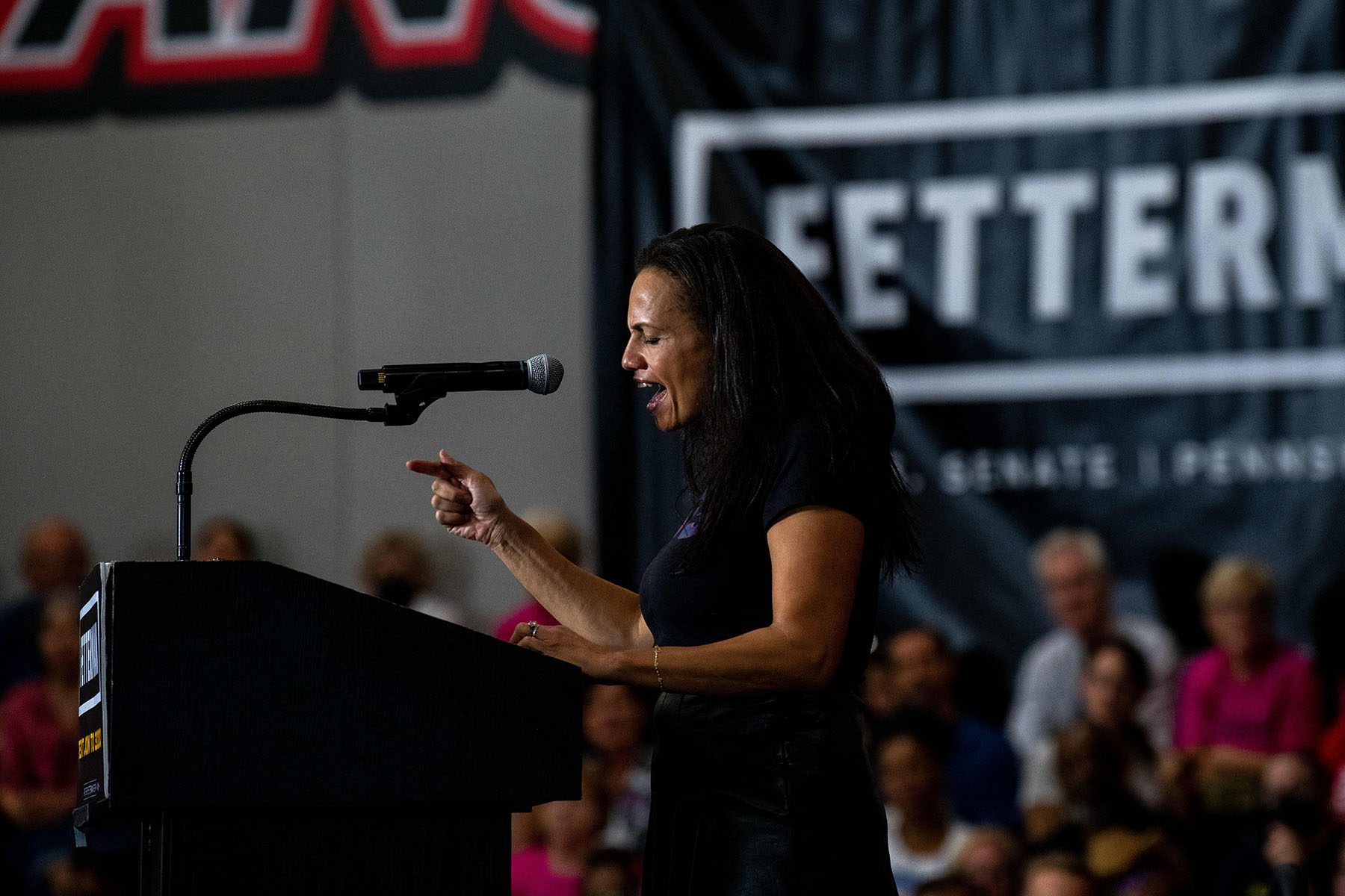 Alexis McGill Johnson speaks at a podium during a "Women For Fetterman" rally.