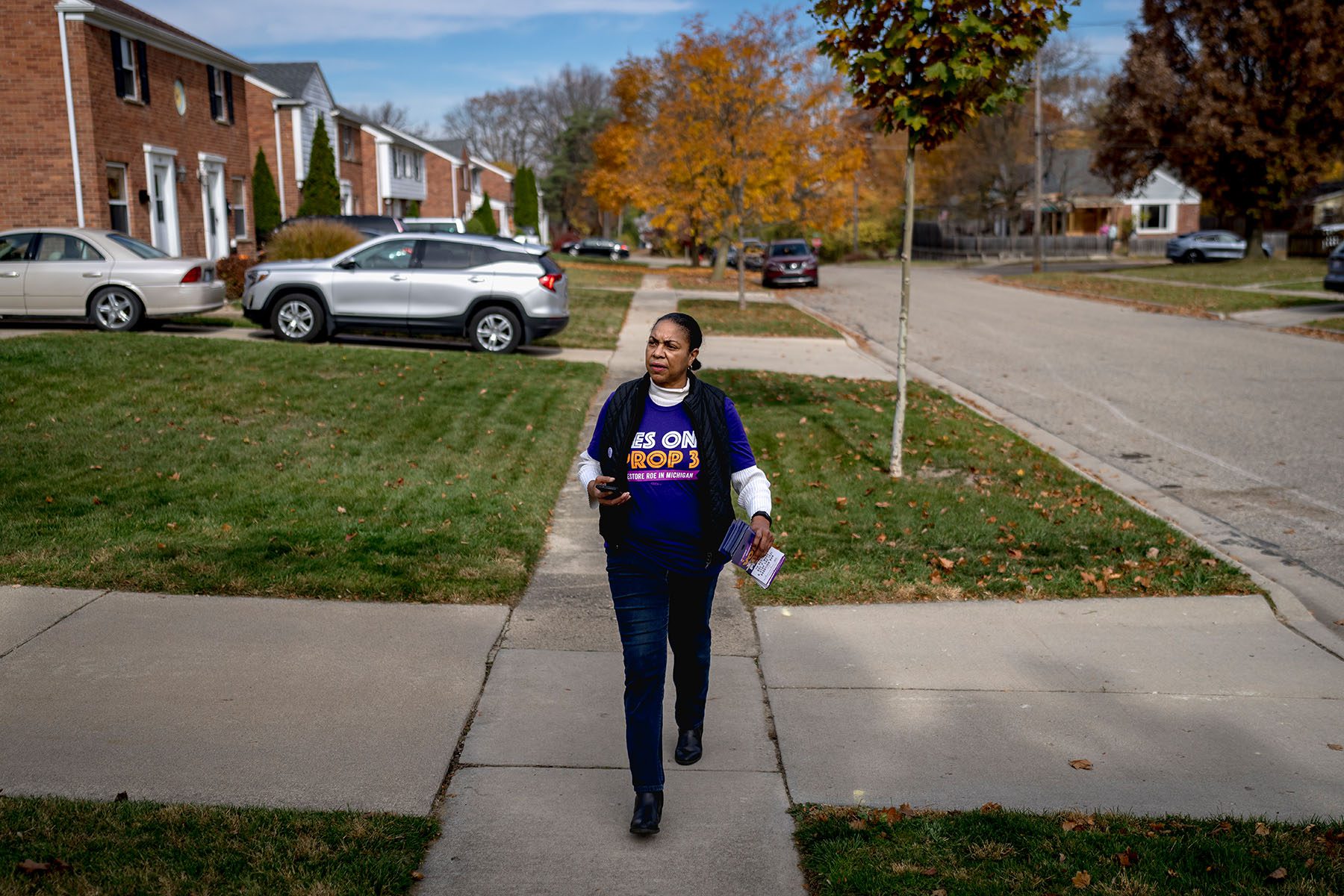 A volunteer canvasses a neighborhood in support of Proposal 3.