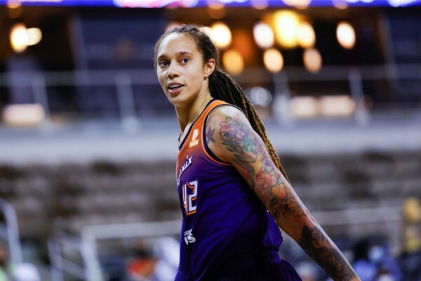 Brittney Griner is seen smiling during a game.