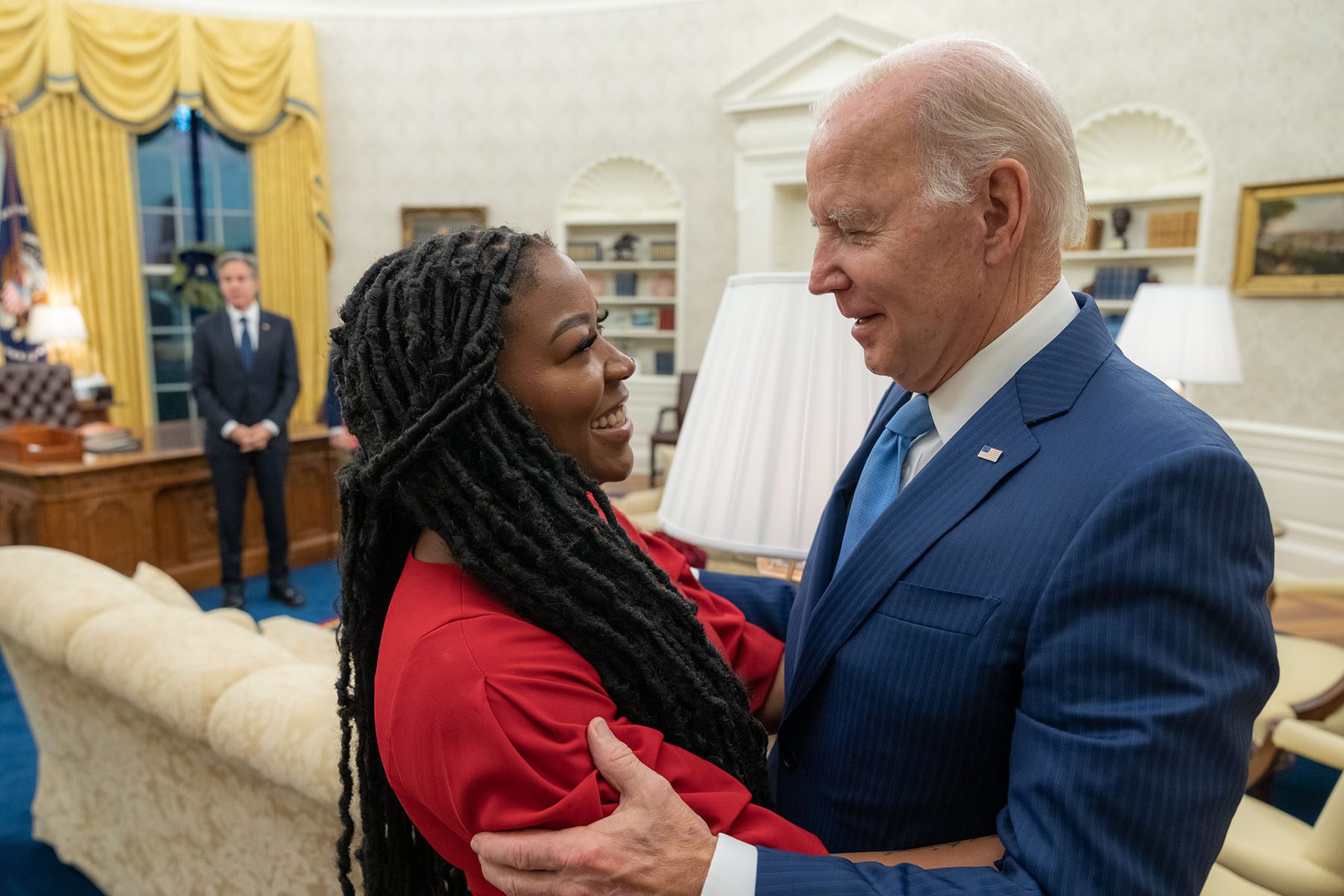 President Joe Biden and Cherelle Griner hold each other and smile after the release of Brittney Griner.