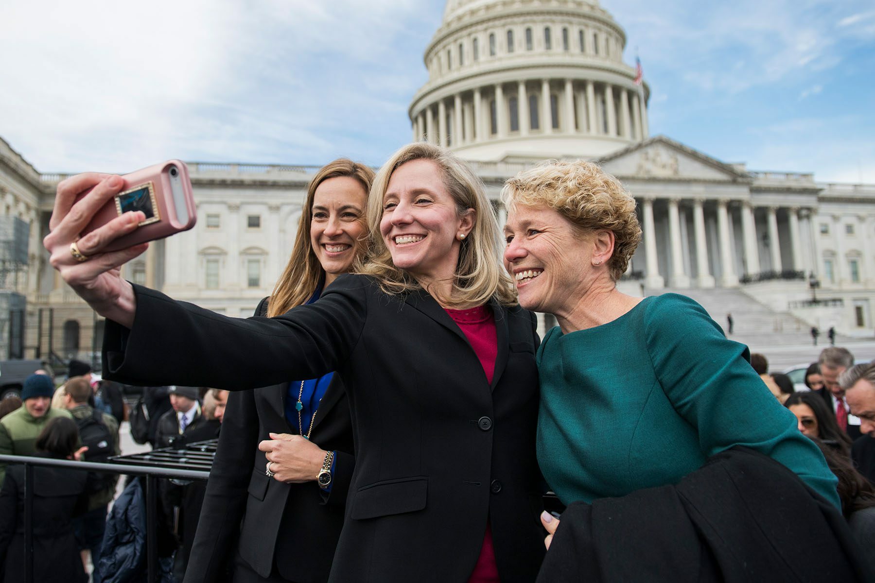 Mikie Sherrill, Abigail Spanberger and Chrissy Houlahan take a selfie in front of the U.S. Capitol.