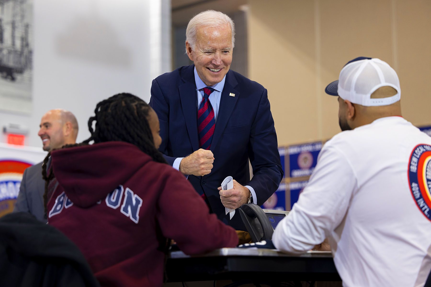 President Biden greets volunteers at a phone banking event for Sen. Warnock's re-election campaign.