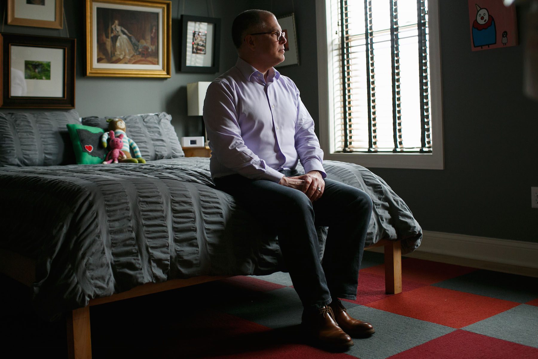 Jim Obergefell sits on a bed in his condo in Cincinnati.