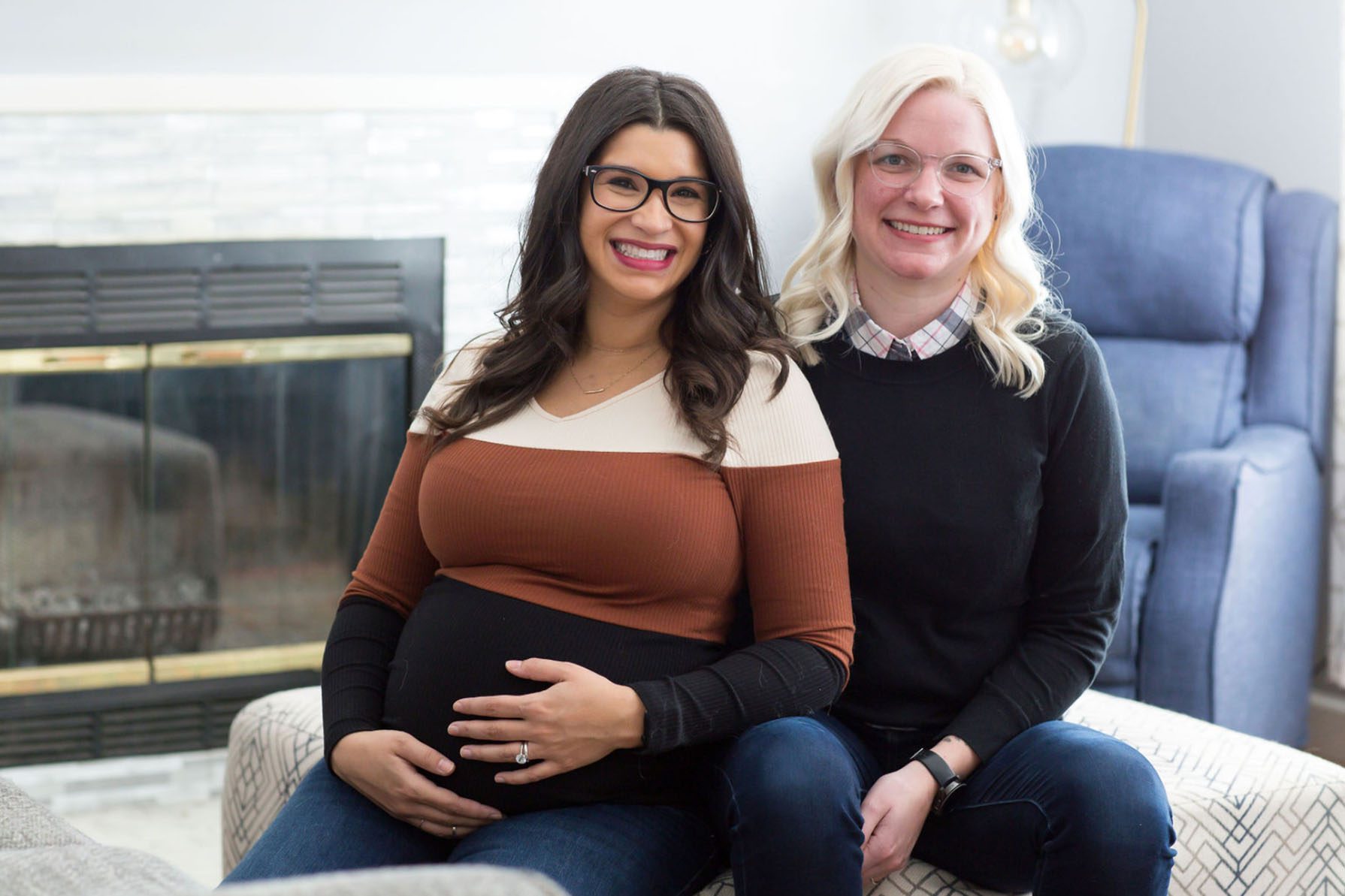 A pregnant Erin Maye Quade poses for a portait with her wife Alyse Maye Quade.