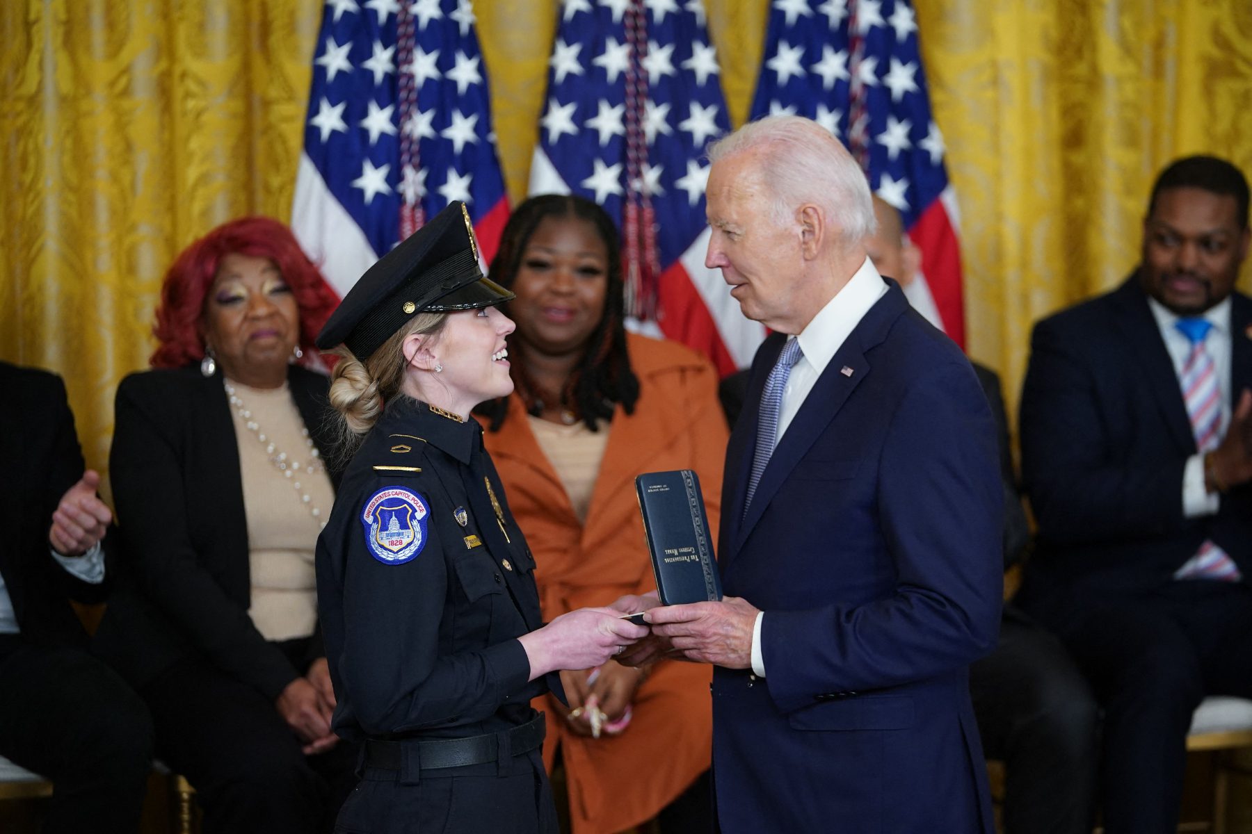Officer Caroline Edwards of the Capitol Police receives the Presidential Citizens Medal from President Joe Biden for her defense of the Capitol on January 6