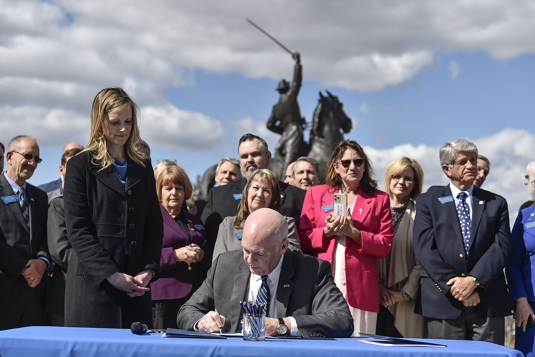 Greg Gianforte, surrounded by lawmakers, signs a bill requiring that women be informed of the opportunity to view an ultrasound before an abortion.