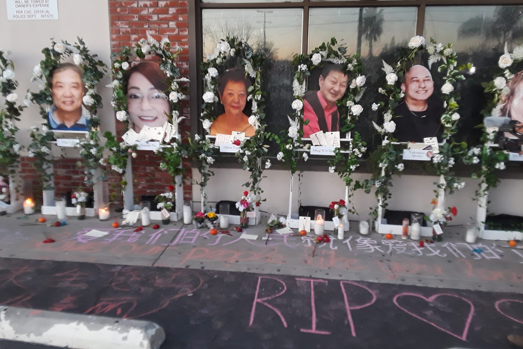 White wreaths surrounding portraits of the 11 victims at the memorial outside Star Ballroom in Monterey Park, Calif.