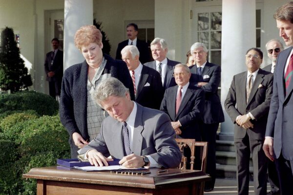President Clinton signs the Family Leave Bill in the Rose Garden of the White House.