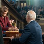President Biden greets Vice President Kamala Harris as he arrives to deliver his State of the Union address.
