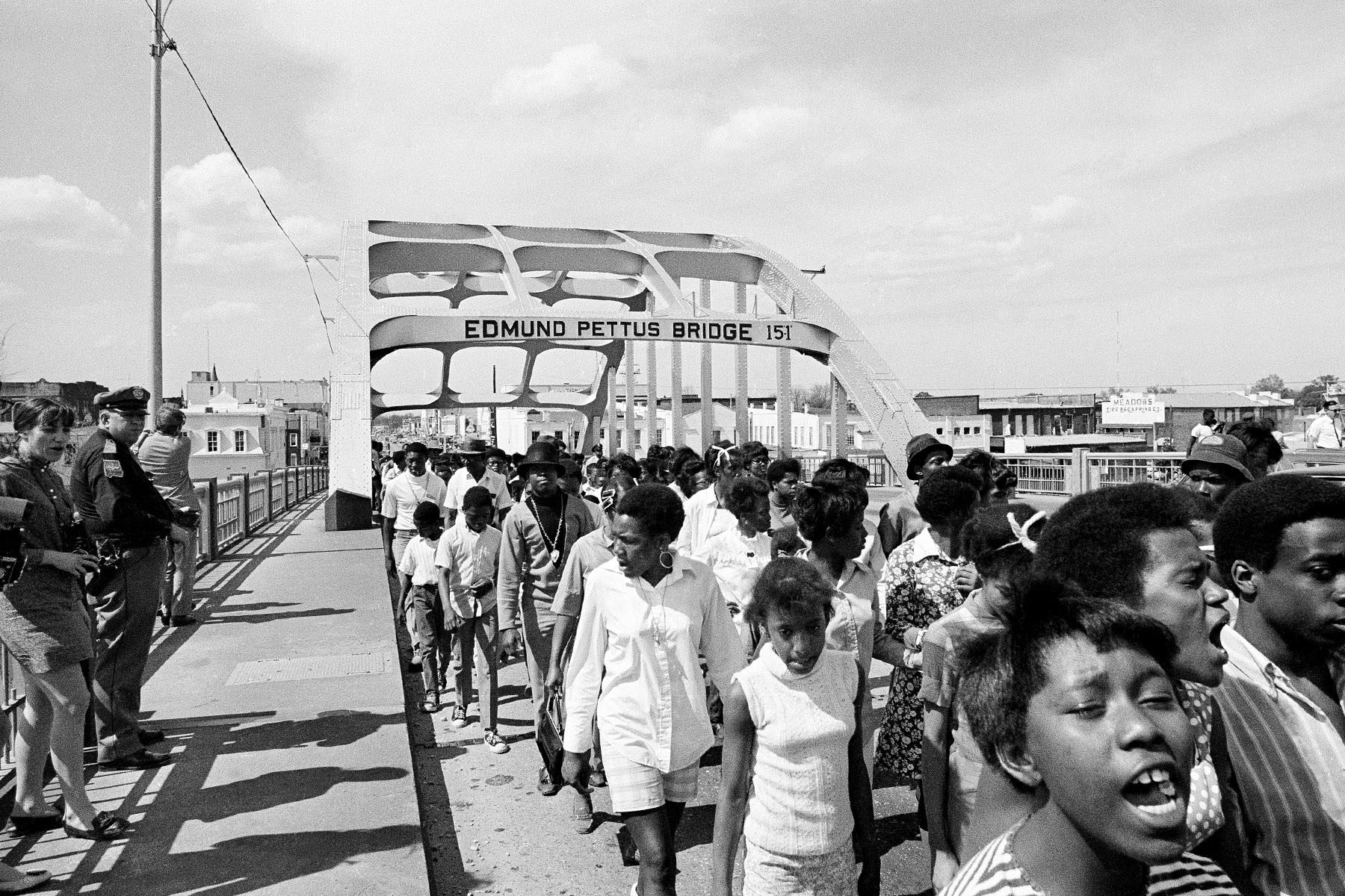 several hundred marchers mark the anniversary of Dr. Martin Luther King's assassination with a memorial walk across the Edmund Pettus Bridge.