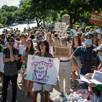 Protesters hold up signs during an abortion-rights rally in Austin, Texas.