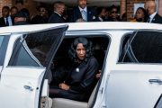 RowVaughn Wells looks on as she gets into a car after the funeral service for her son, Tyre Nichols, at Mississippi Boulevard Christian Church.
