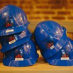 Hardhats labeled with girls' names are seen at a Tools & Tiaras workshop.