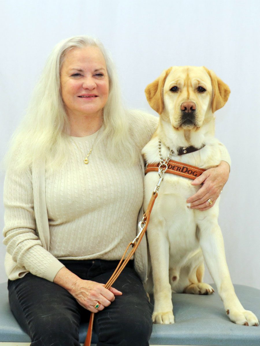 A photo of Moira Shea and her guide dog.