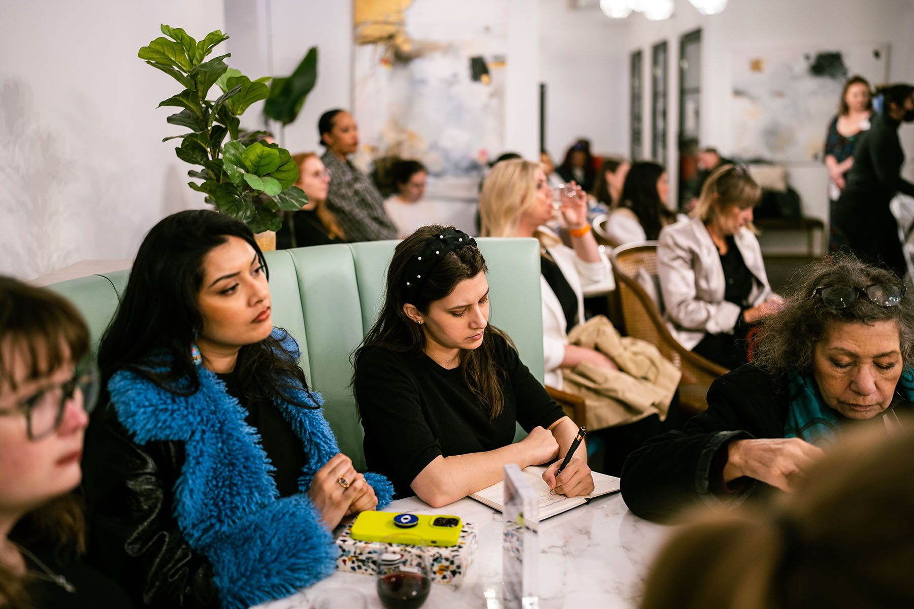 Attendees listen at "The 19th Celebrates: International Women's Day" event at The Luminary in New York City on March 7, 2023.