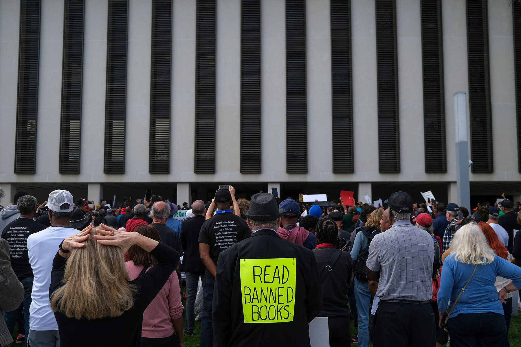 Demonstrators protest Governor Ron DeSantis' plan to eliminate Advanced Placement courses on African American studies in high schools as they stand outside the Florida State Capitol.