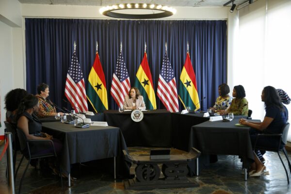 U.S. Vice President Kamala Harris sits at a table with women entrepreneurs.