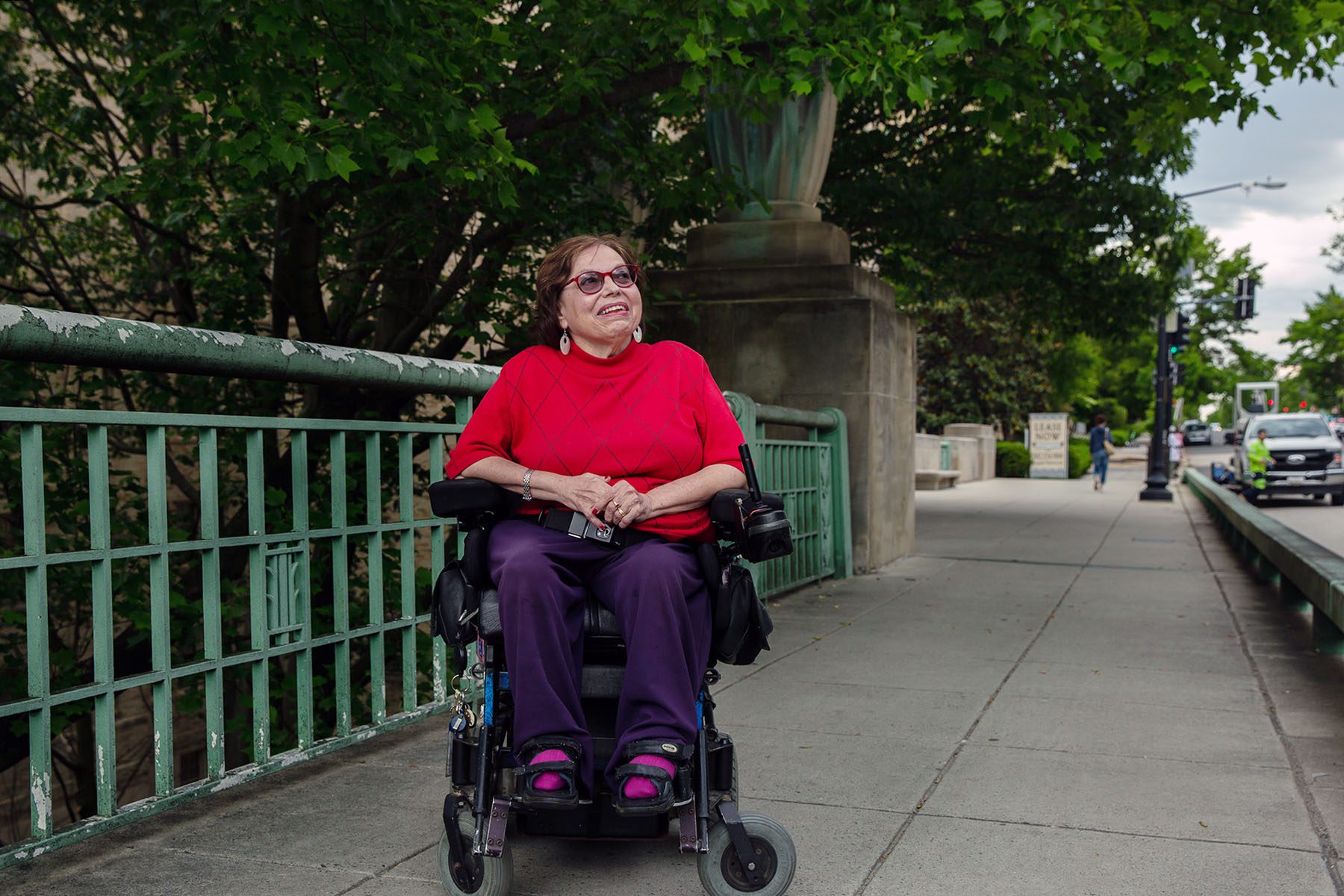 Judy Heumann poses for a portrait outside.