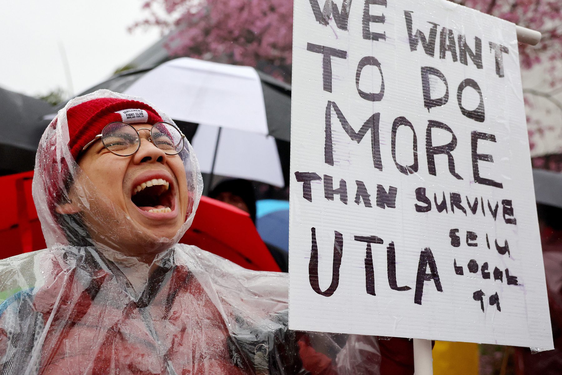 Mathematics teacher Robert Jong holds a sign at a strike for Los Angeles school workers.