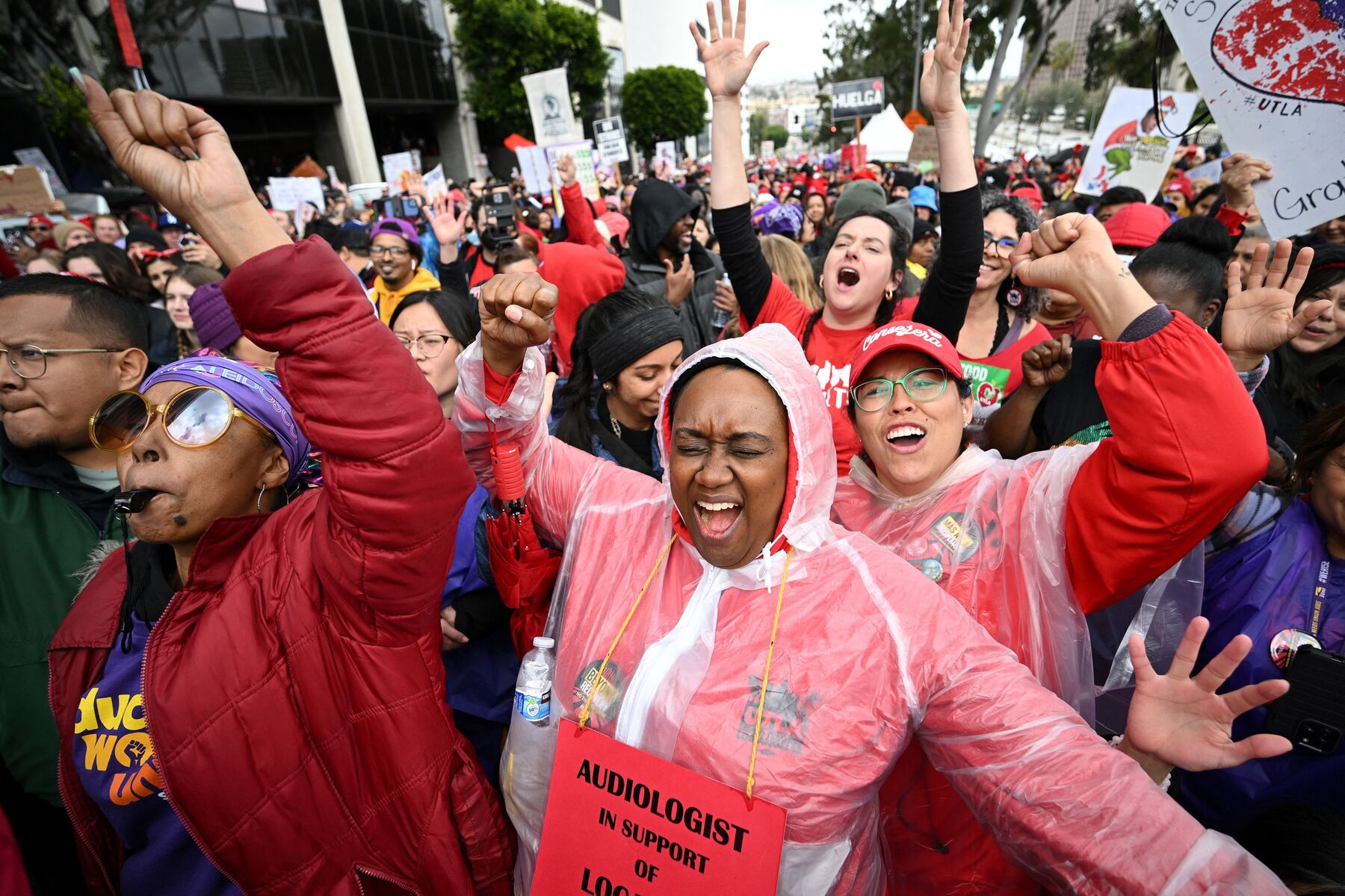 Los Angeles school workers walk in a strike for fair wages.