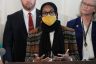 Oklahoma State Rep. Mauree Turner, in glasses and a yellow mask, speaking in Oklahoma City