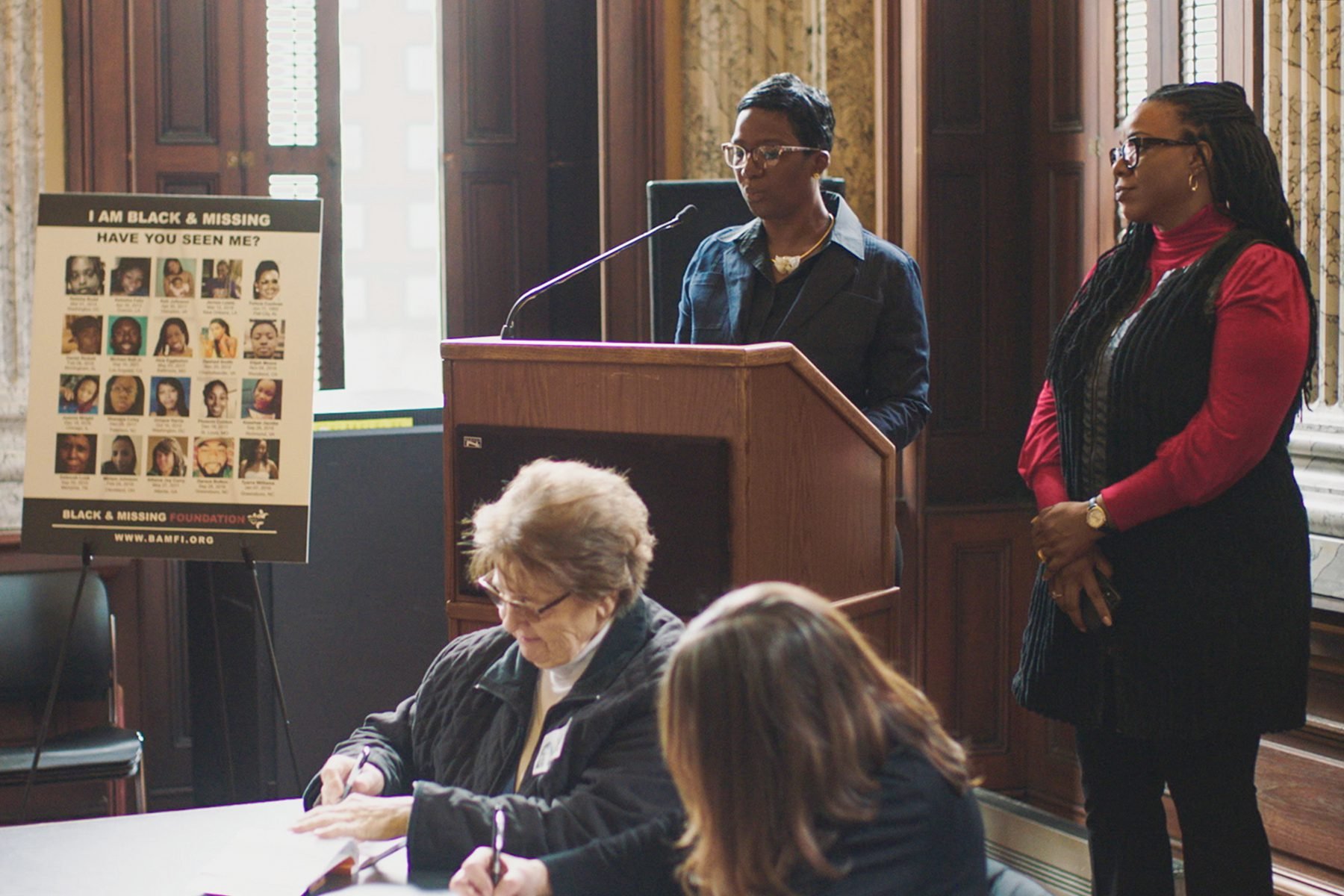 Natalie and Derrica Wilson, the co-founders of the Black and Missing Foundation make a presentation at Baltimore City Hall.