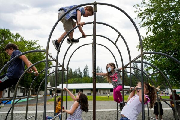 Elementary school students play during recess.