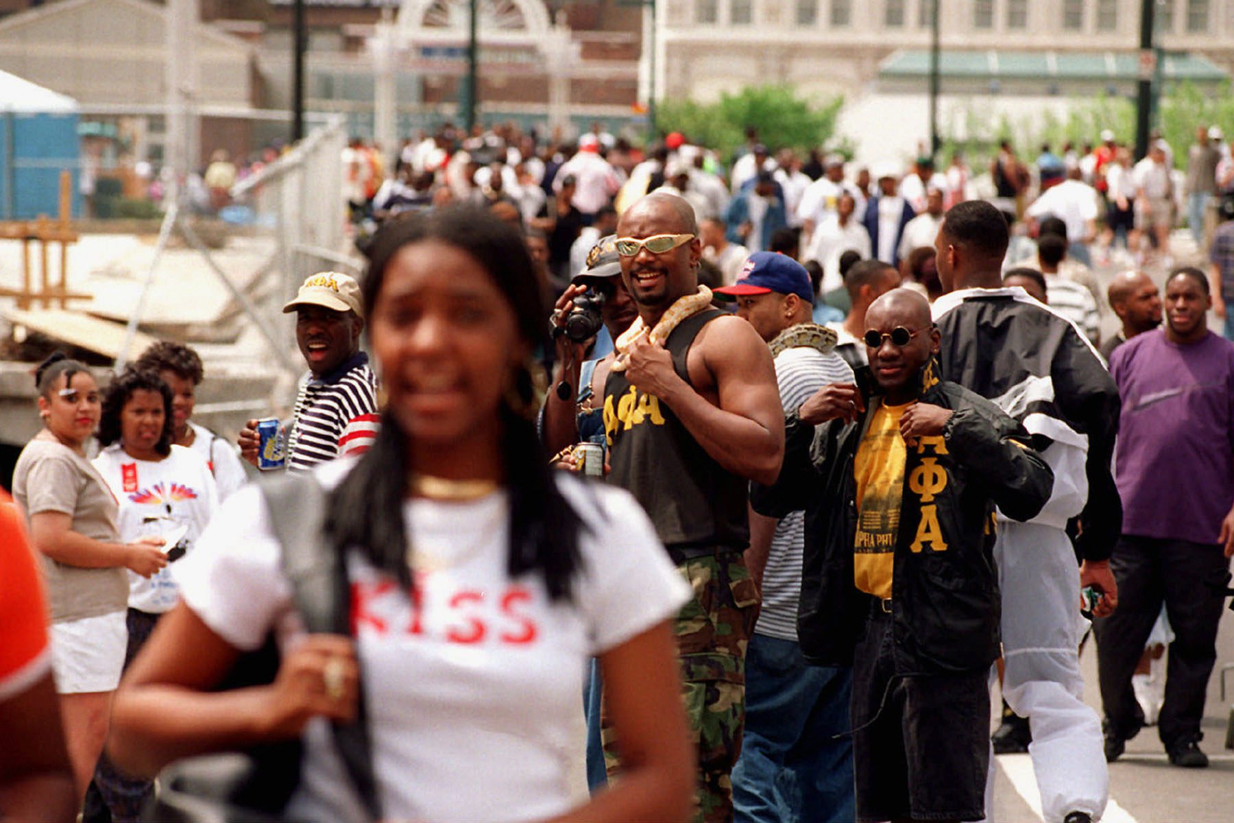 Woman passes group of Alphas and other freaknik attendants.