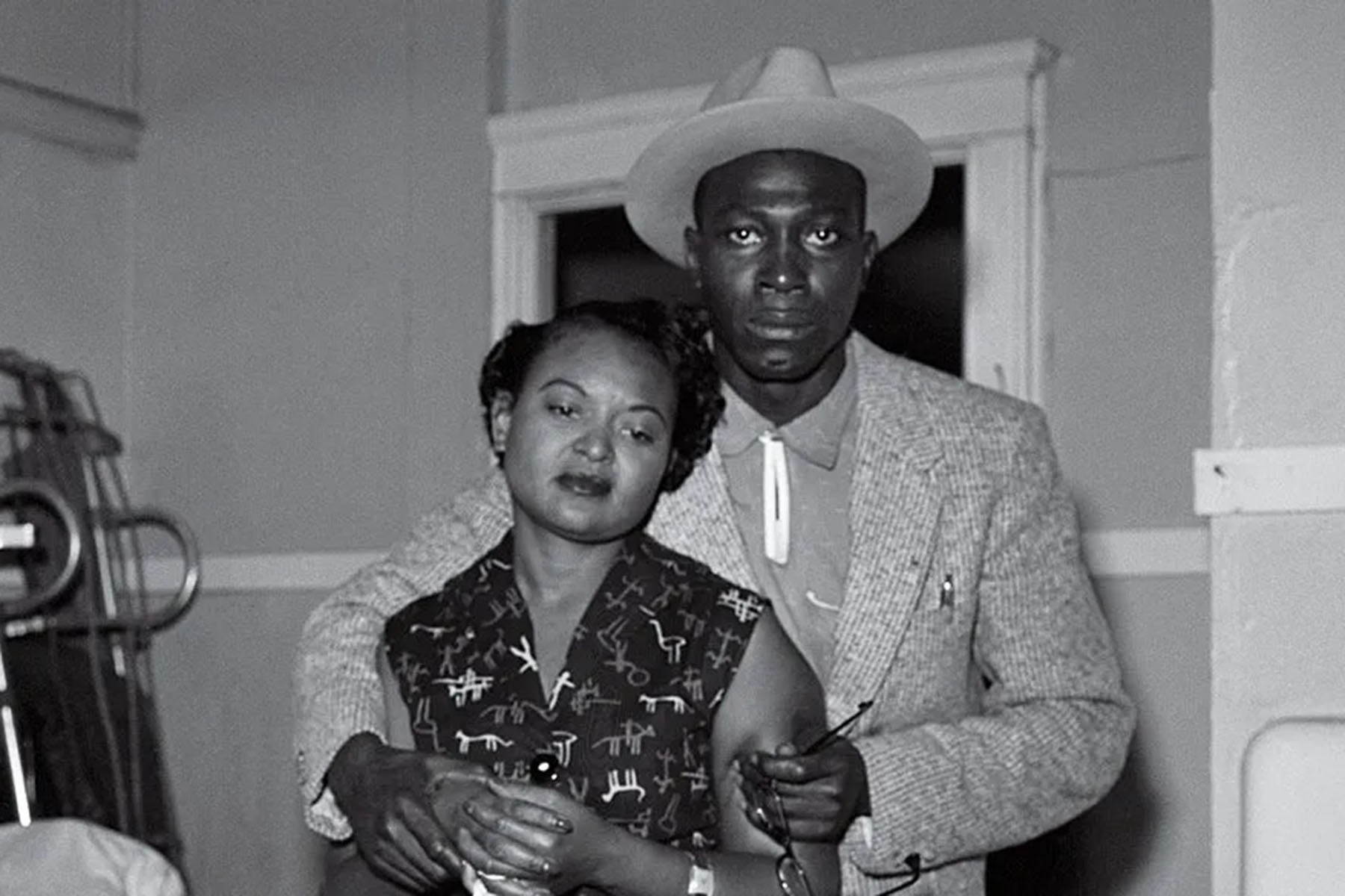 Mamie Till looks at the brutalized body of her son, Emmett Till. She is comforted by Gene Mobley, whom she would later marry.