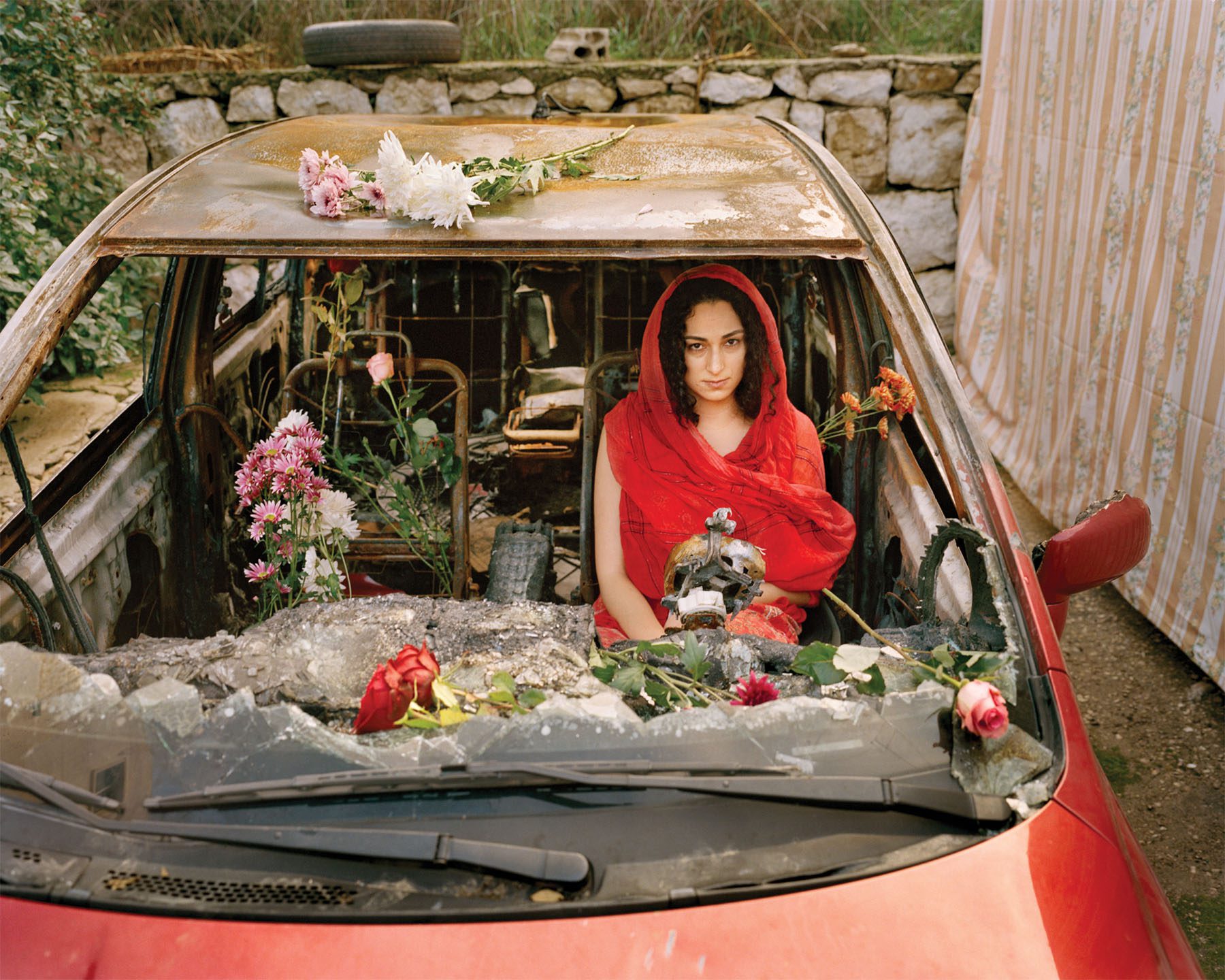 Women in dilapidated car