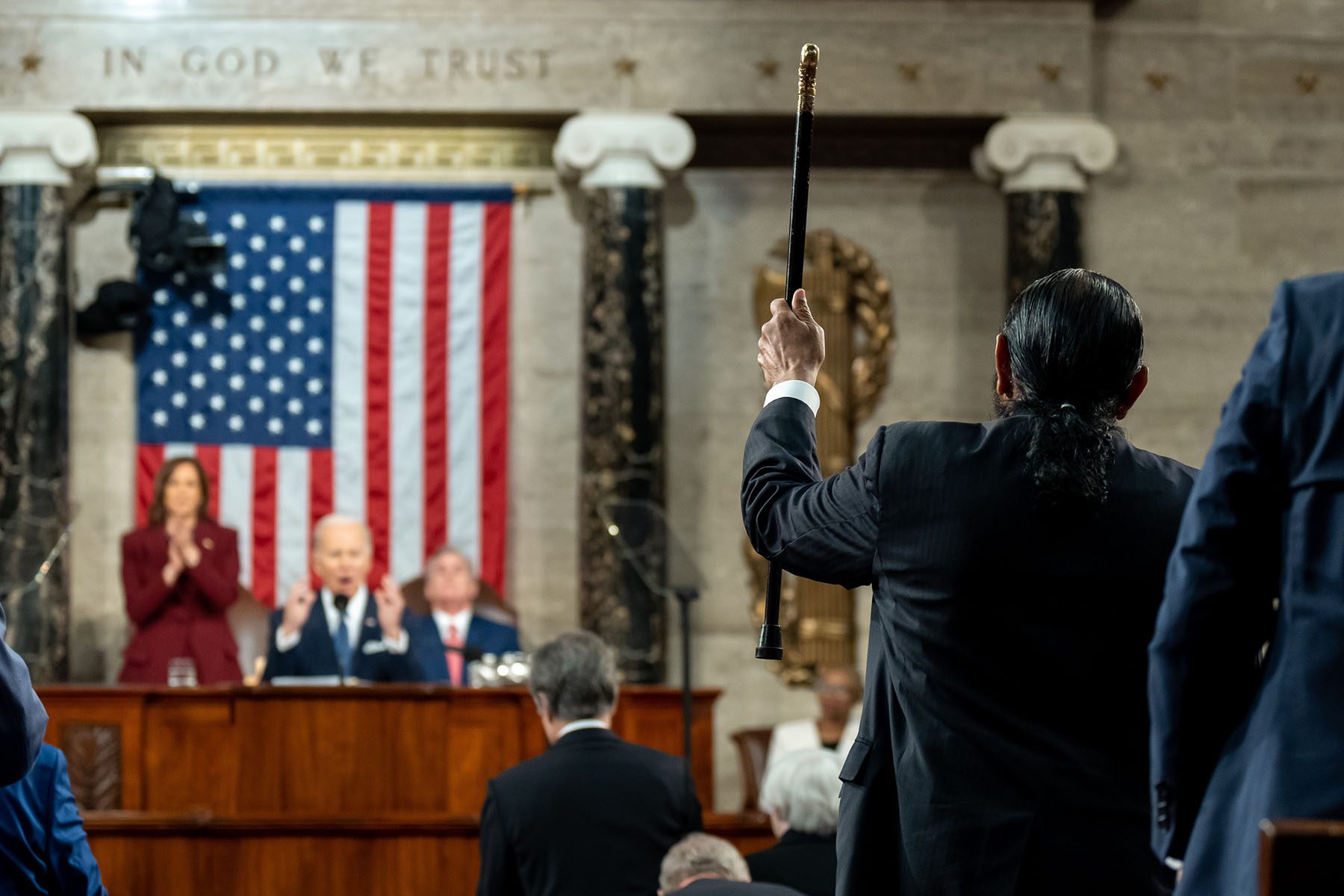 President Biden delivers his State of the Union address as people react on the House floor of the Capitol.