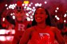 A Rutgers Scarlet Knights cheerleader performs before a college basketball game.