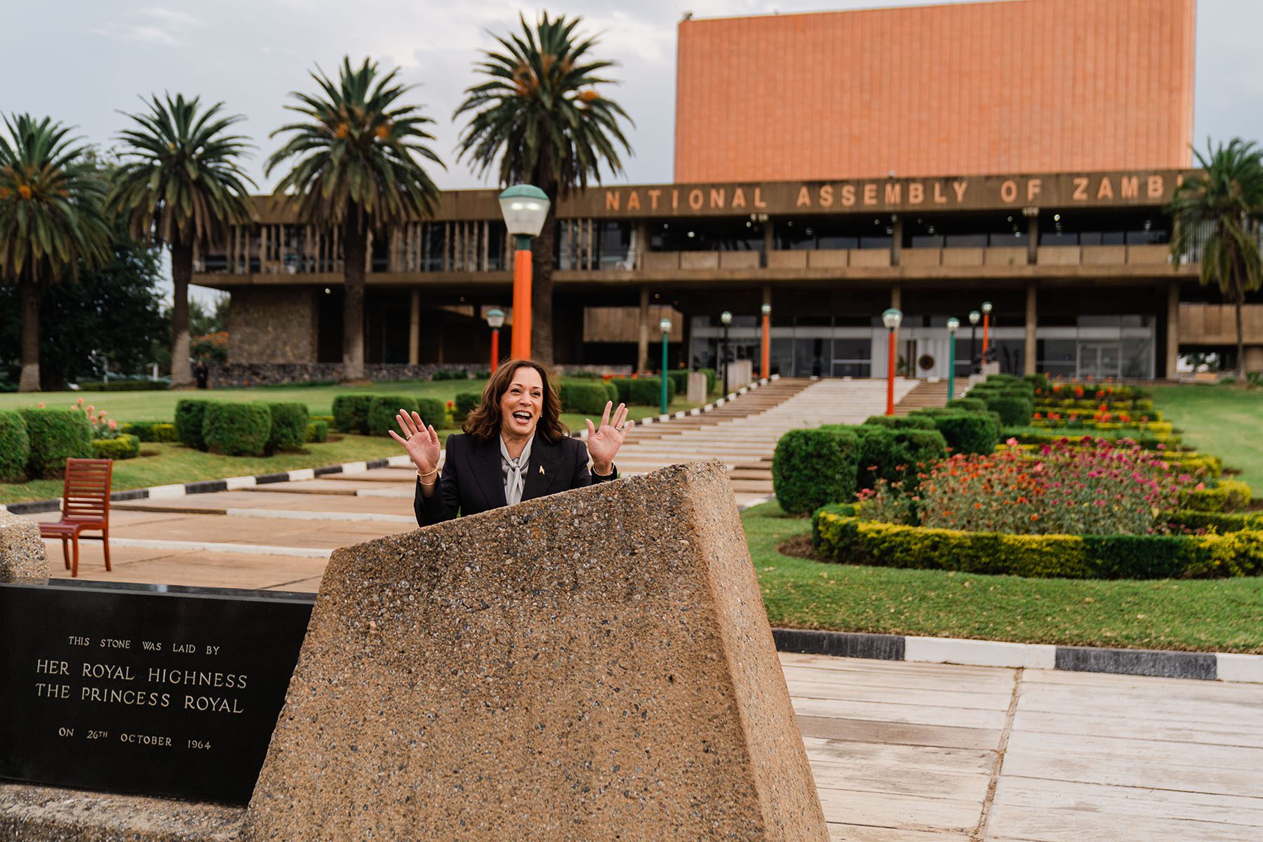 Kamala Harris gestures while speaking about the photograph as a child taken in the same place in March 2023.