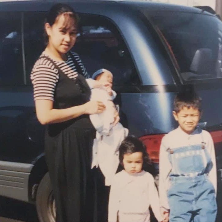 Mariel, her mom and siblings pose in front of "The Blue Whale."