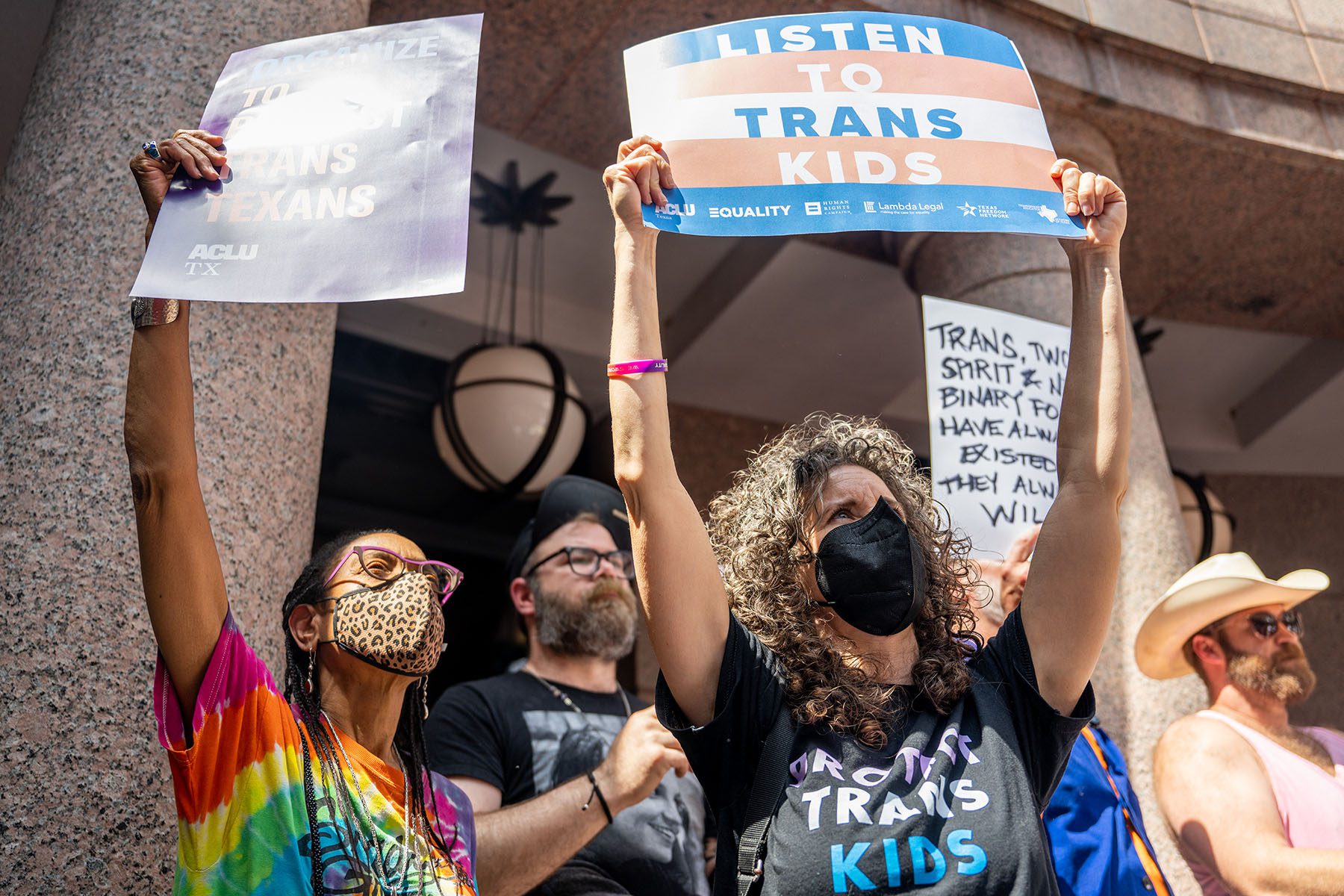 People protest bills HB 1686 and SB 14, which seek to limit healthcare to transgender youth, during a rally at the Texas State Capitol.