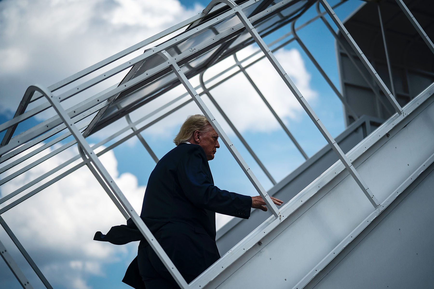 Donald Trump boards his airplane at Palm Beach International Airport.